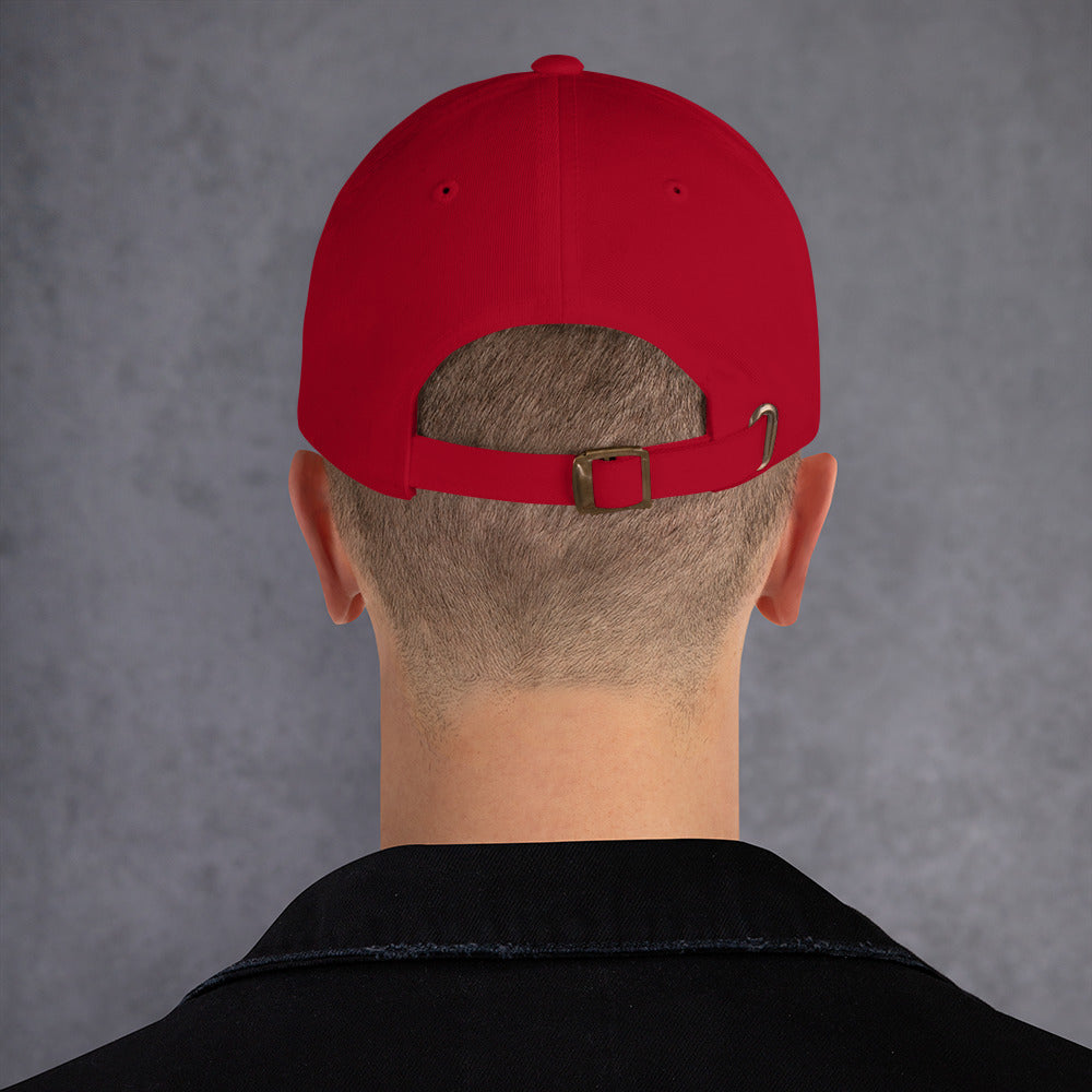 Back view of a red Dad hat showcasing adjustable strap and low-profile design.
