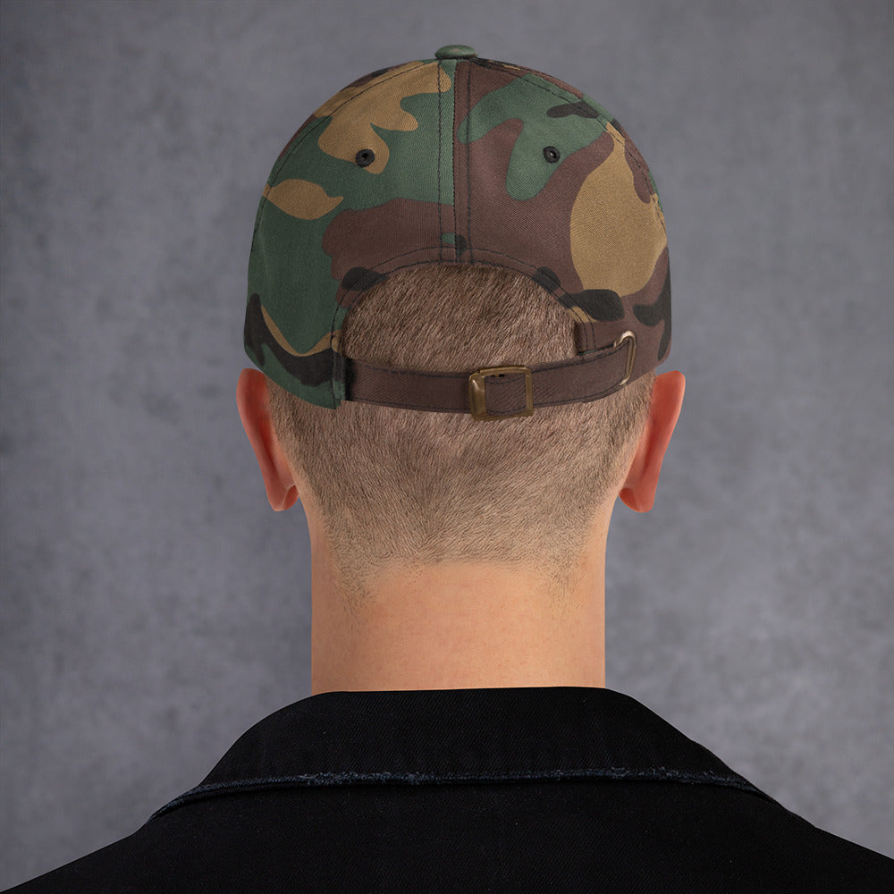 Back view of a Dad hat in green camo with adjustable strap, showcasing its low-profile design.