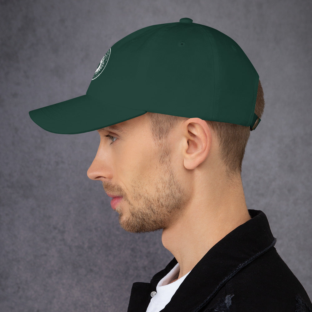Side view of a man wearing a green Dad hat with a curved visor and adjustable strap.