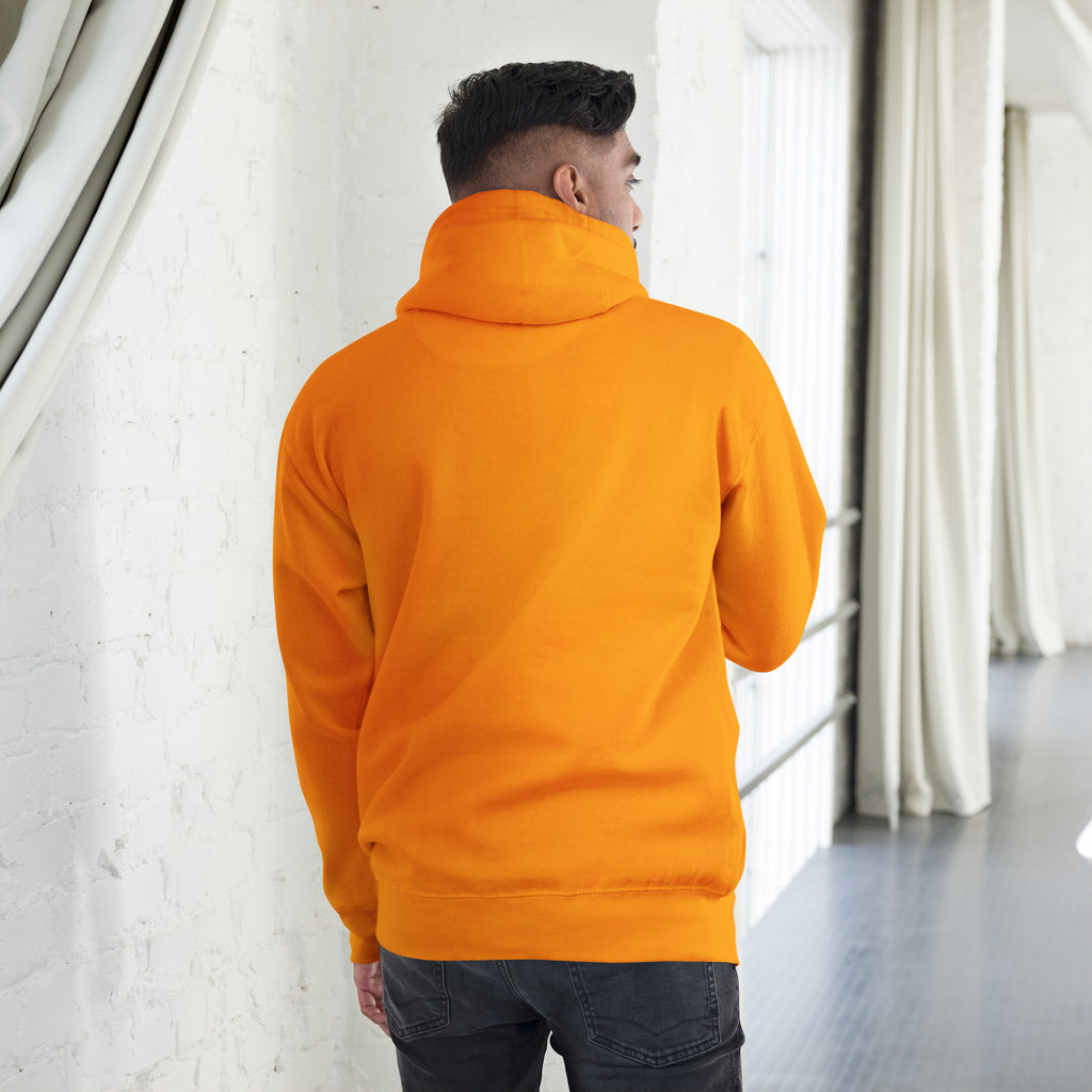 Back view of a model wearing an orange Unisex Hoodie showcasing its warm hood and comfortable fit.