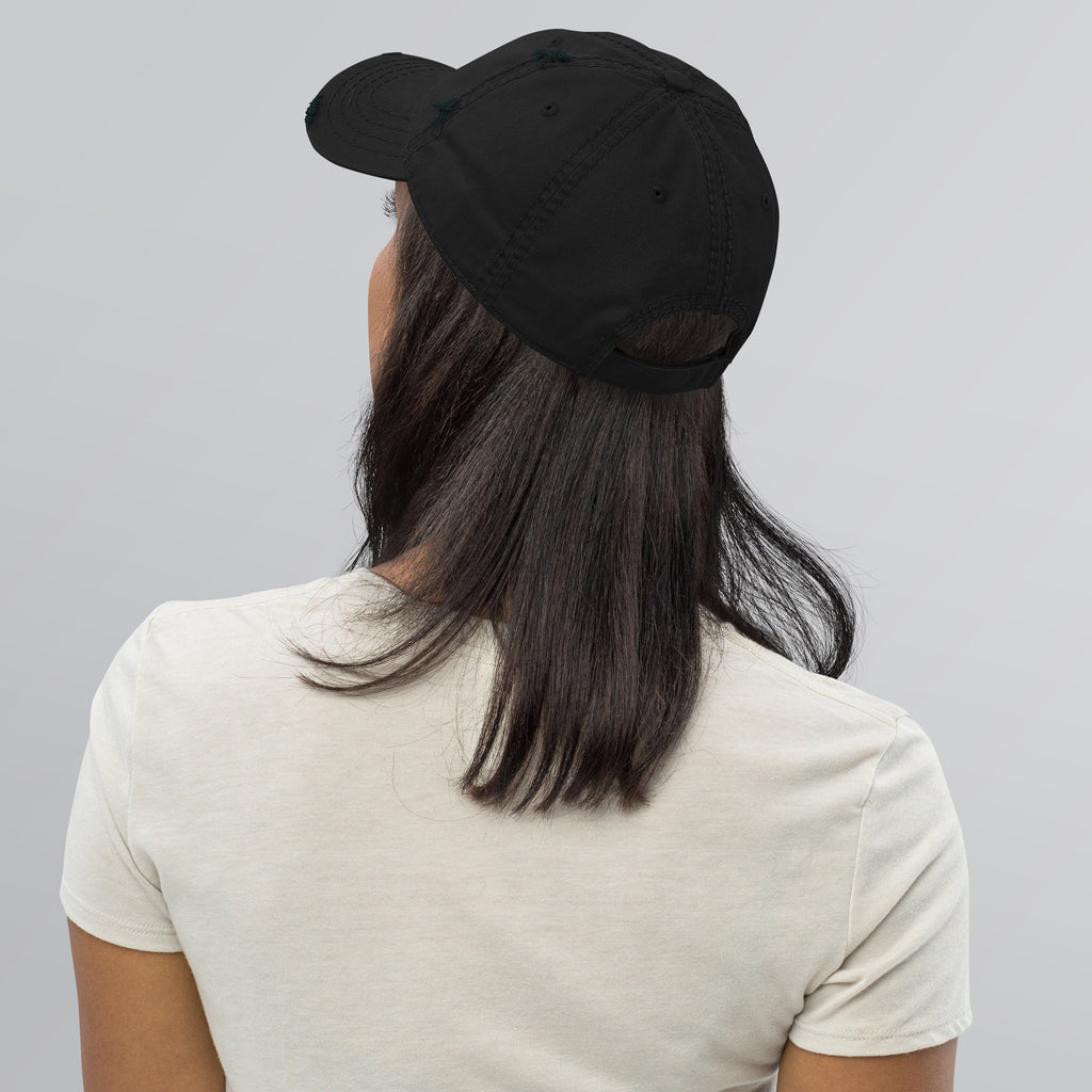 Distressed Dad Hat worn by a woman from the back, showcasing its soft crown and slightly distressed design.