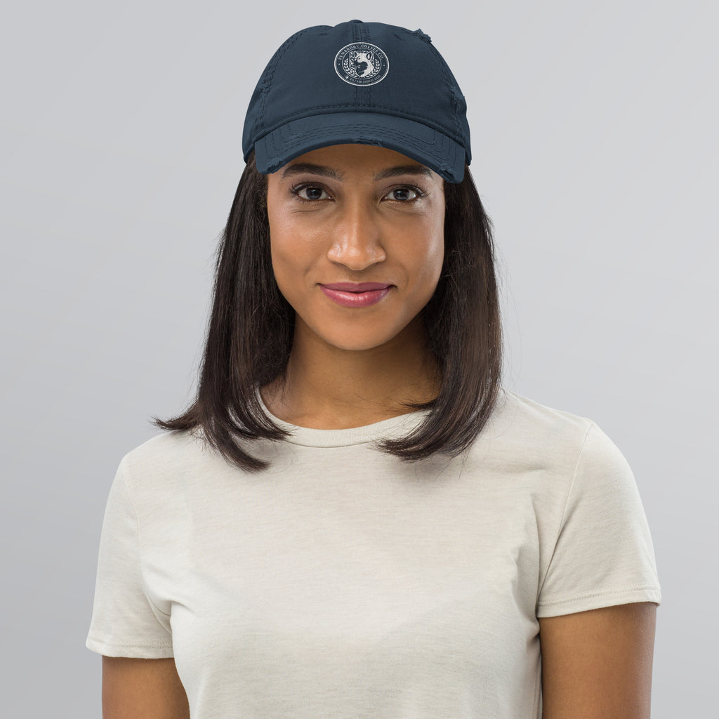 Woman wearing a Distressed Dad Hat, showcasing its casual style and soft crown design.