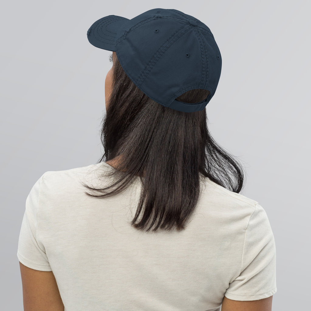Back view of a person wearing a Distressed Dad Hat, showcasing the soft crown and low profile design.