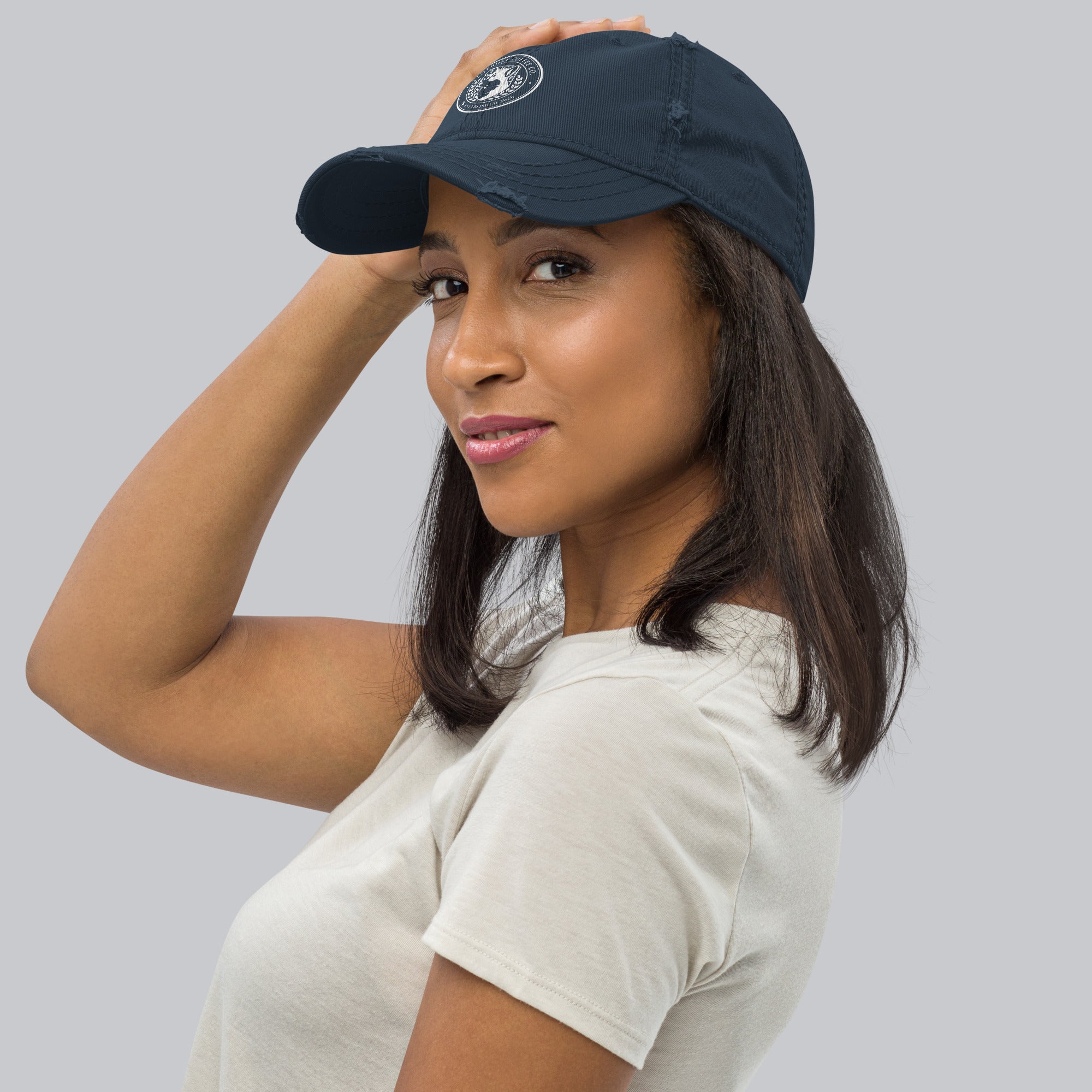 Model wearing a Distressed Dad Hat with a slight edge, showcasing its stylish design and comfortable fit.