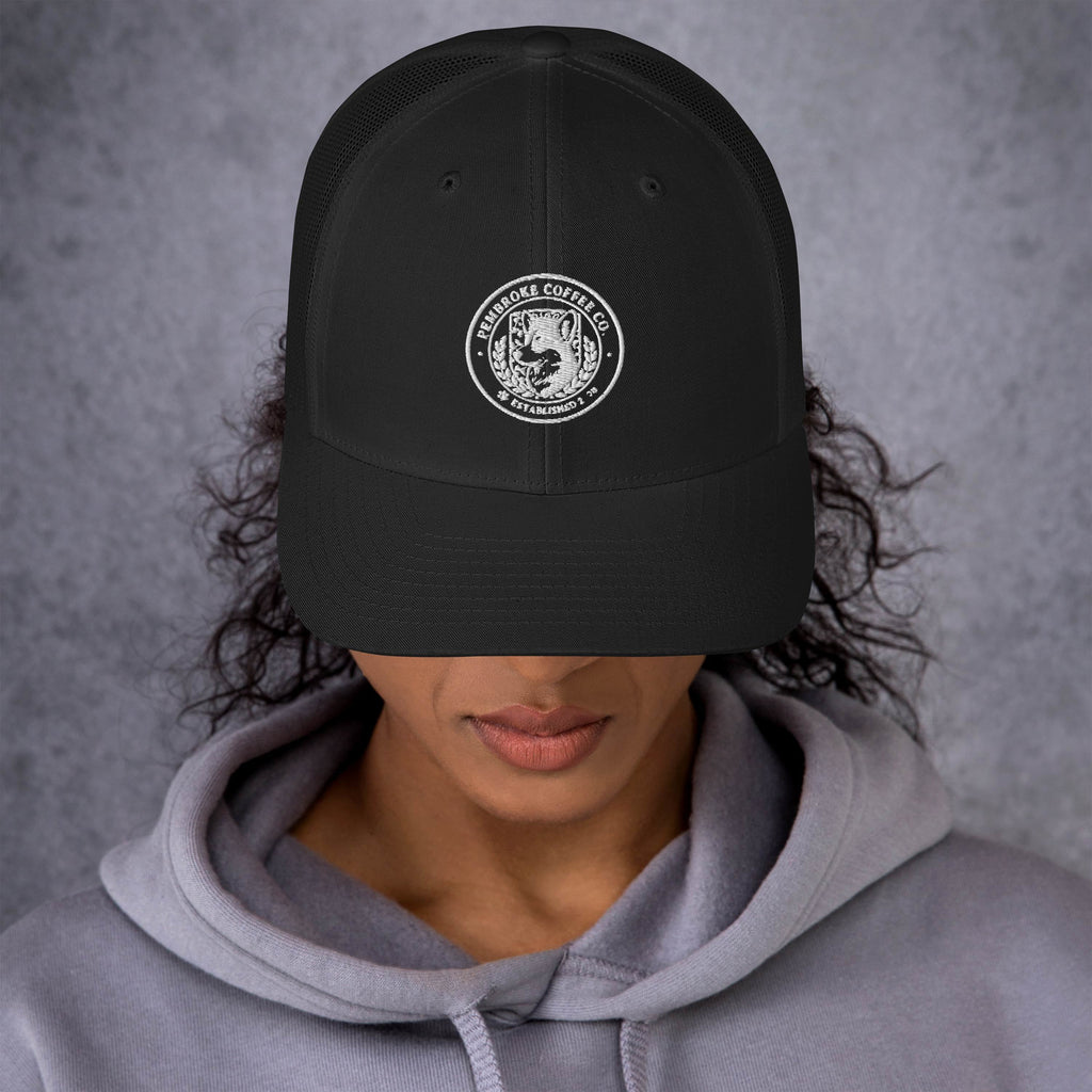Trucker Cap featuring a black design with a logo, ideal for a stylish look on sunny days.