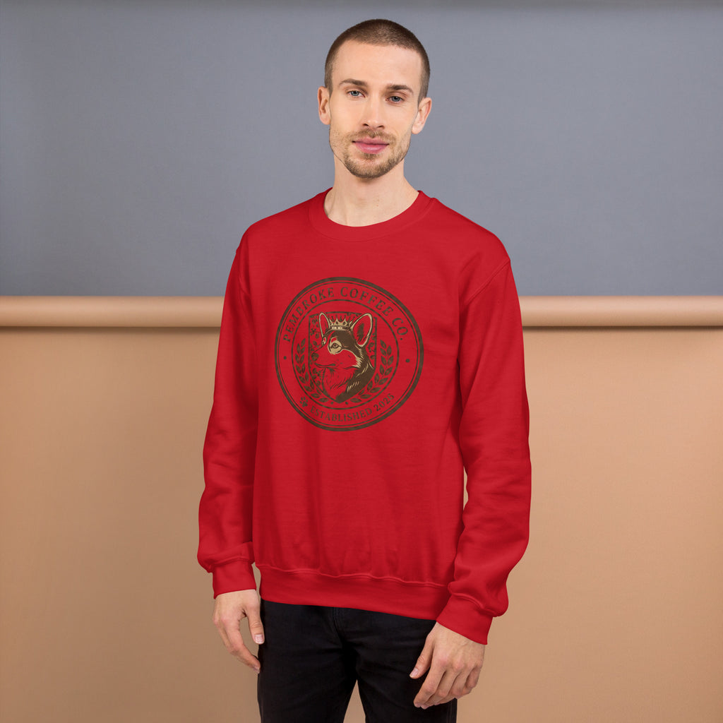 Unisex Sweatshirt in red featuring a decorative logo design on the front, perfect for cooler weather.