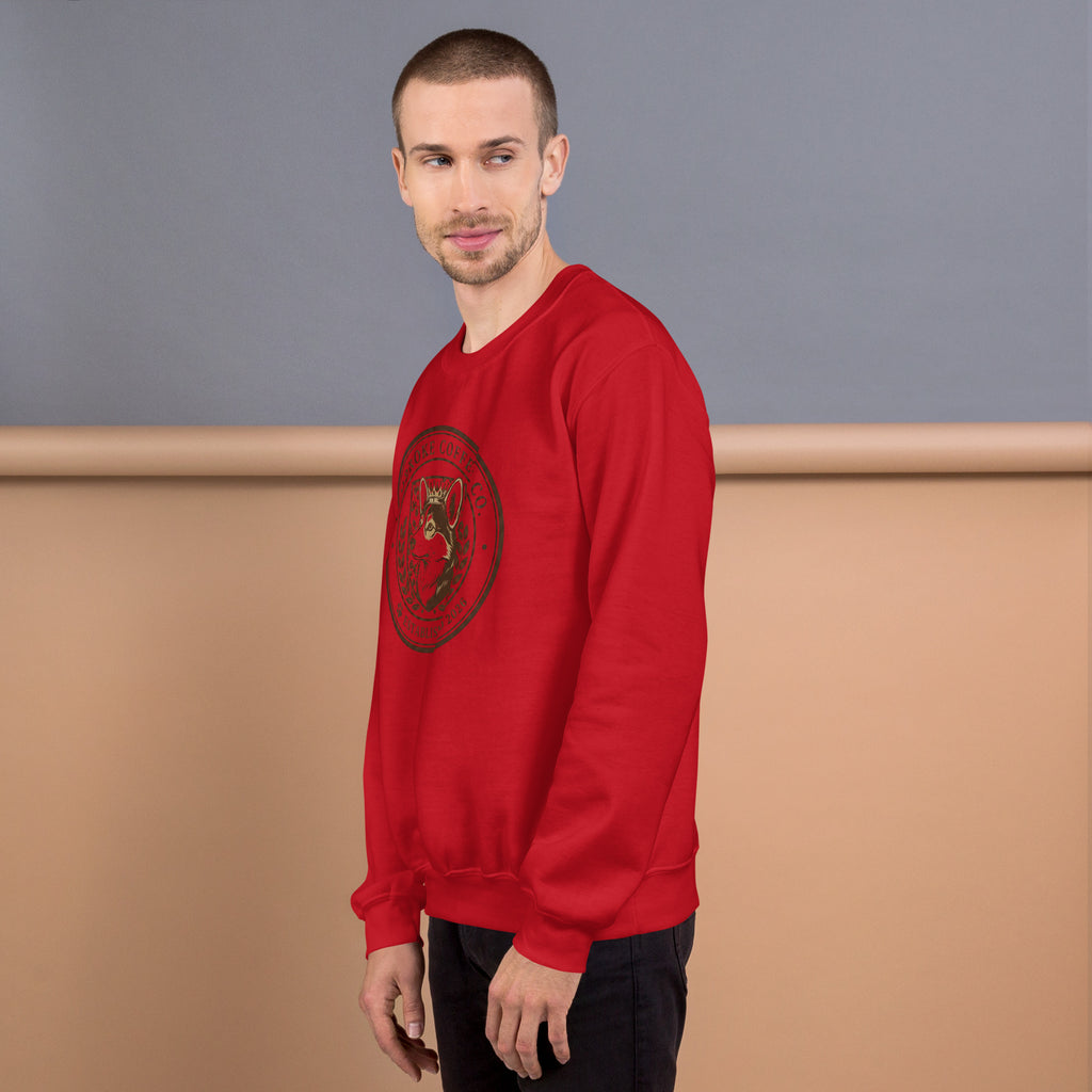 Unisex Sweatshirt in red worn by a male model, featuring a graphic design, perfect for colder months.