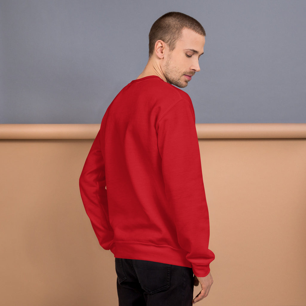 Unisex Sweatshirt in red worn by a model showcasing the back view against a neutral background.