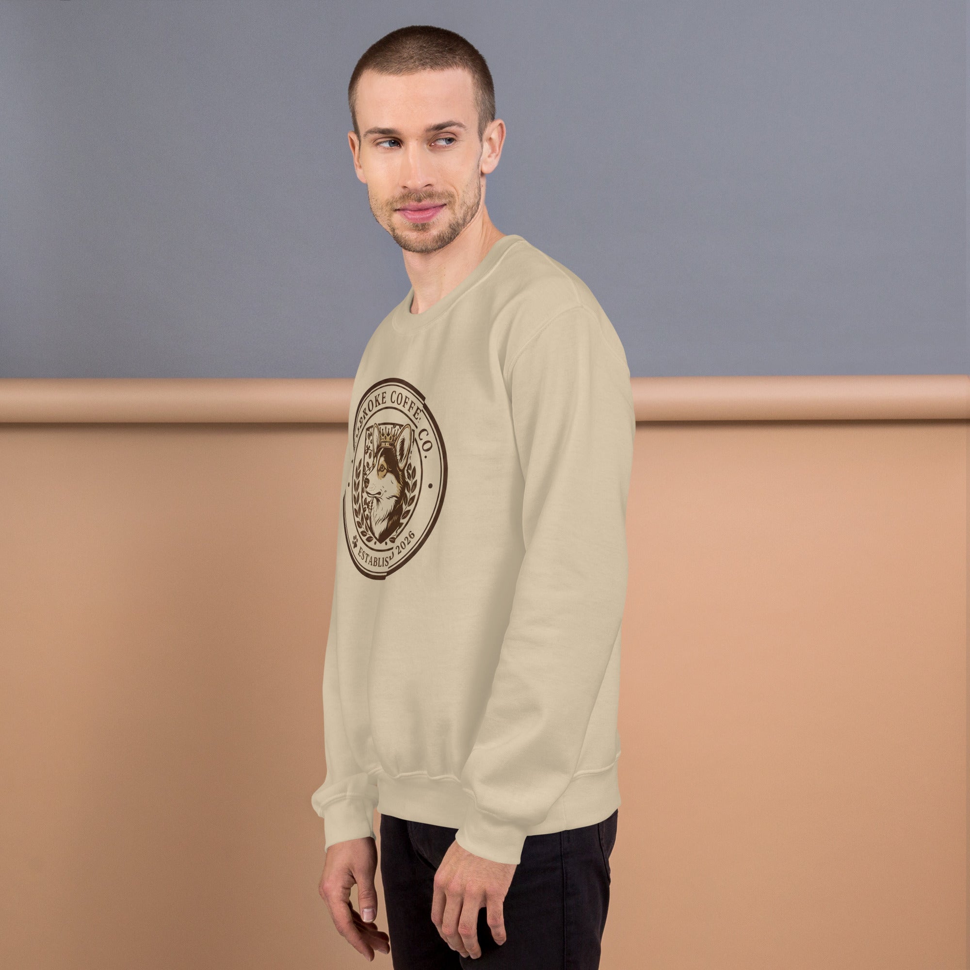 Unisex Sweatshirt worn by a man, featuring a logo design, ideal for colder months.