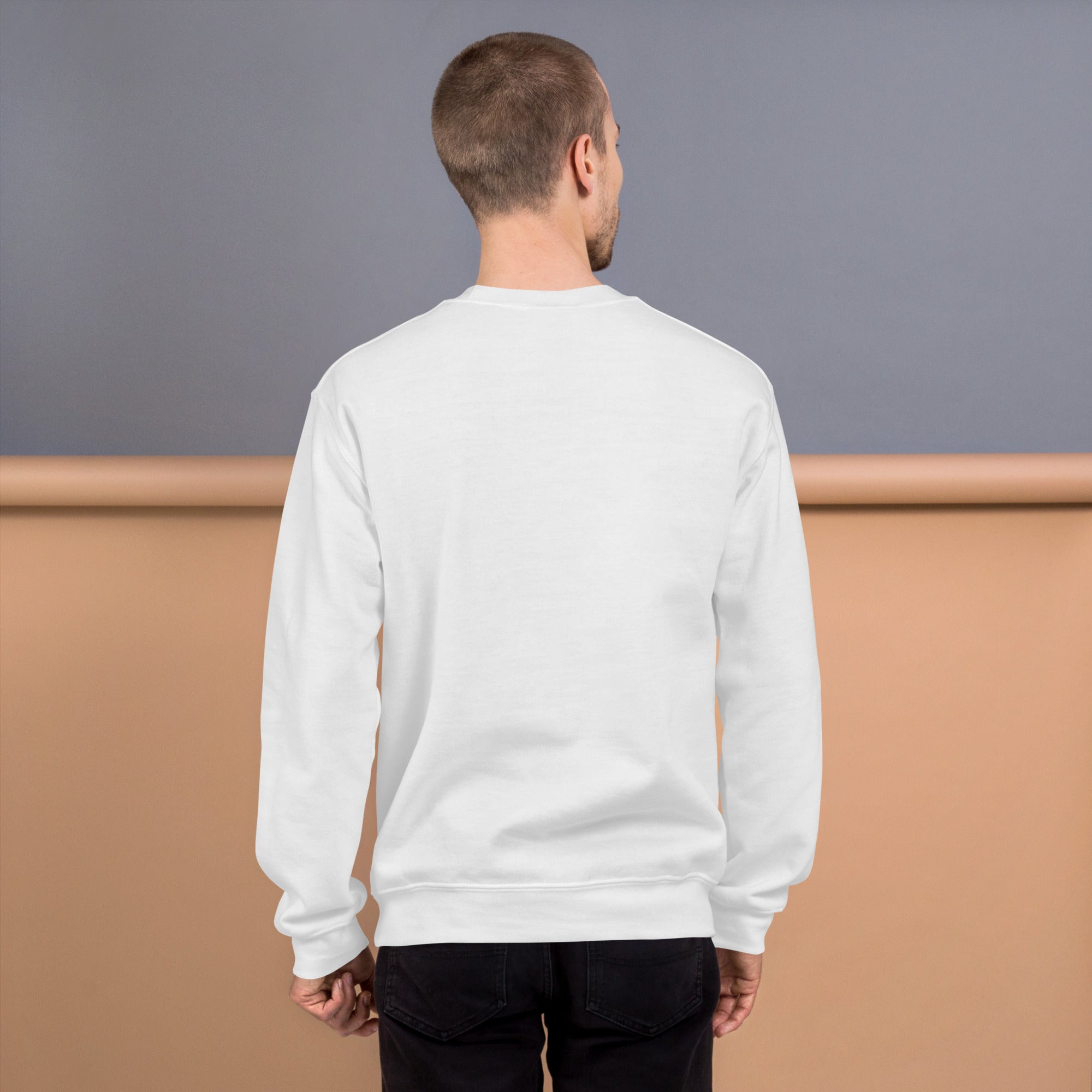 Back view of a man wearing a white Unisex Sweatshirt, showcasing its classic fit and comfortable design.