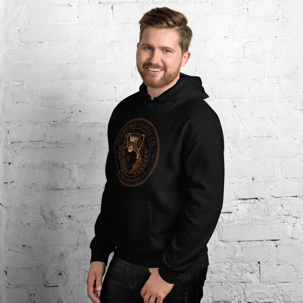 Model wearing a Unisex Hoodie featuring a unique logo design, perfect for stylish comfort.