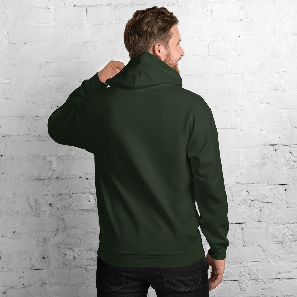 Back view of a man wearing a stylish Unisex Hoodie against a brick wall background.