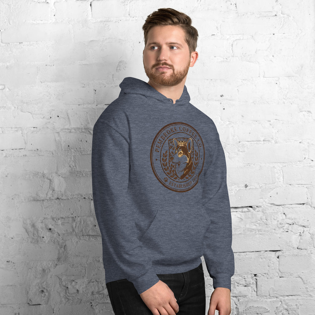 Model wearing Unisex Hoodie with graphic design on a gray background, showcasing comfort and style.
