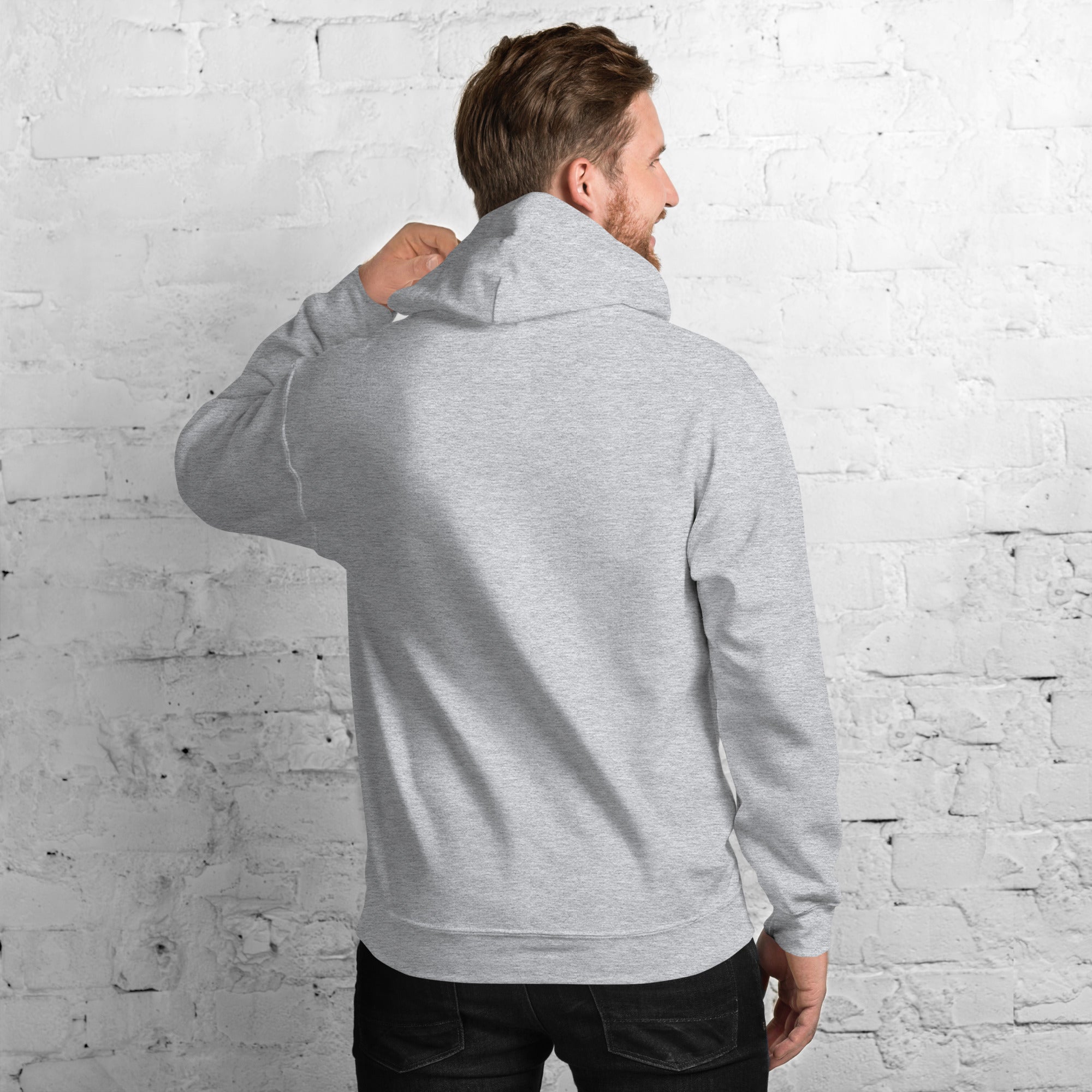 Unisex Hoodie being worn from behind, showcasing its stylish design and cozy fabric.
