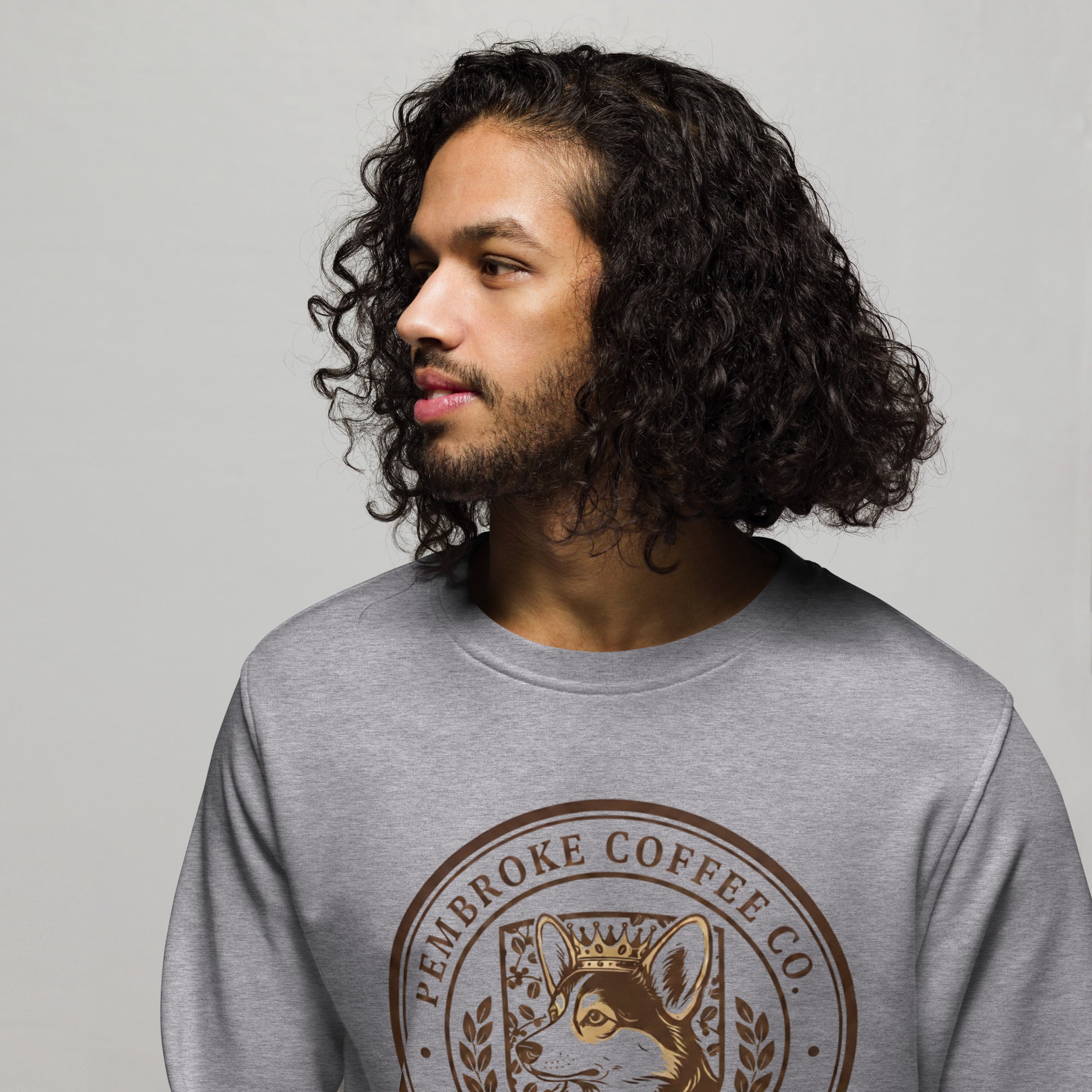 Unisex organic sweatshirt featuring a stylish design, made from organic and recycled materials, modeled by a man.