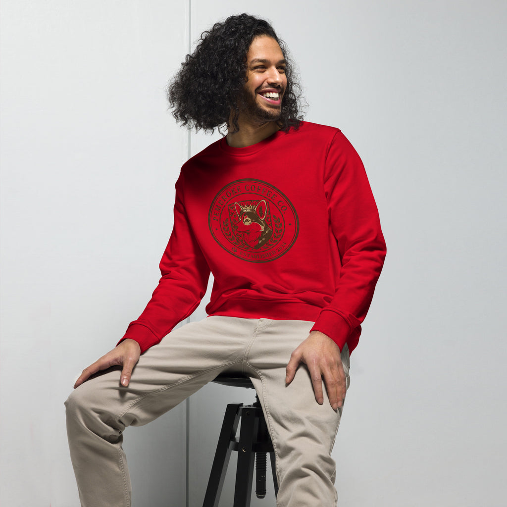 Man wearing a red Unisex organic sweatshirt with graphic design, showcasing comfort and style.