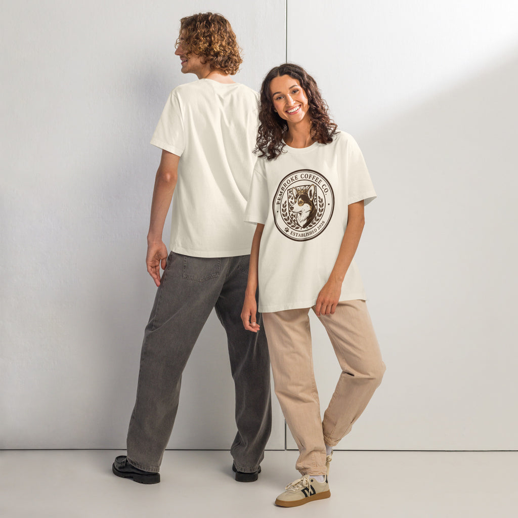 Unisex oversized t-shirt showcased by two models in a stylish streetwear setting, highlighting its relaxed fit and trendy design.