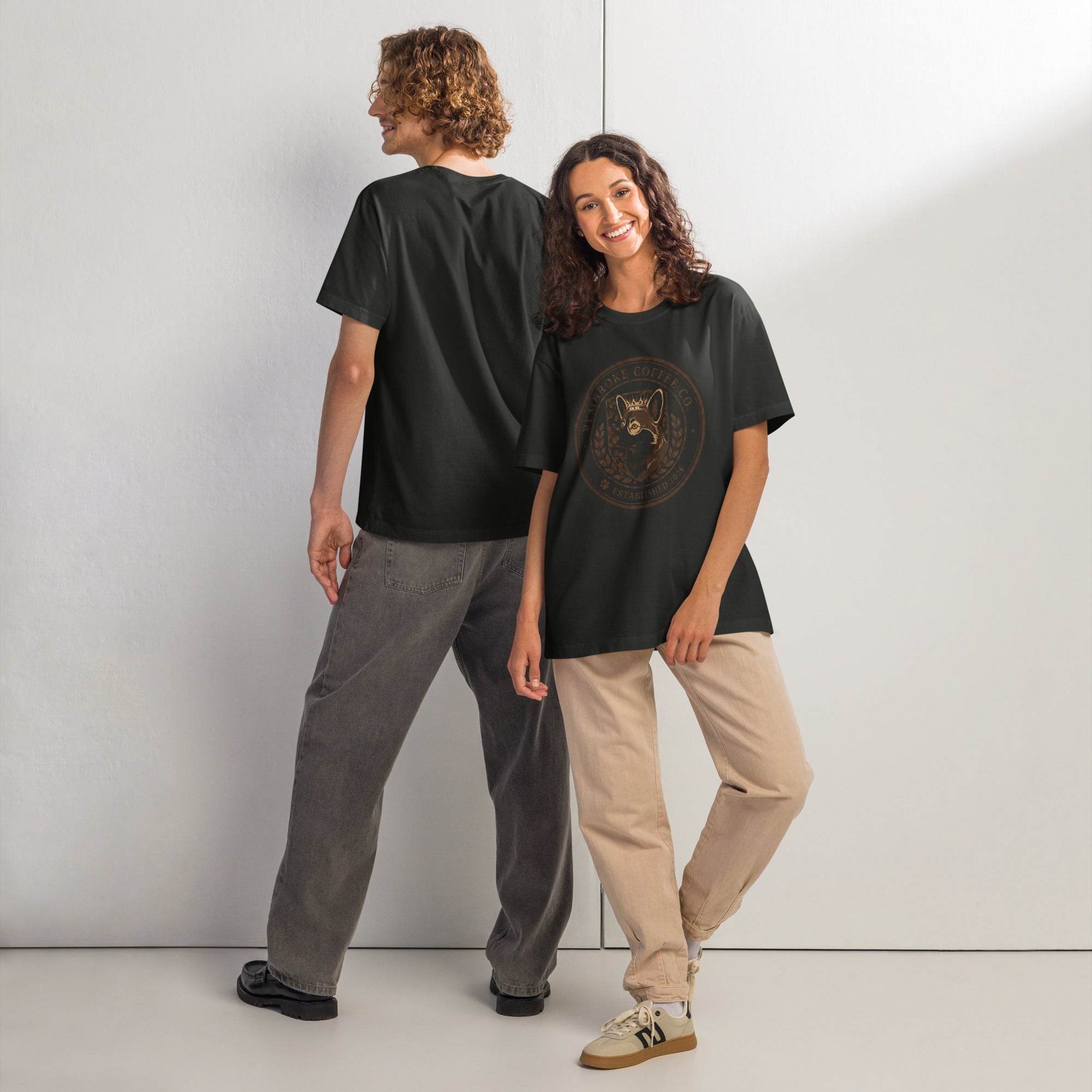 Two models showcasing a Unisex oversized t-shirt with vintage design on a minimalist background.