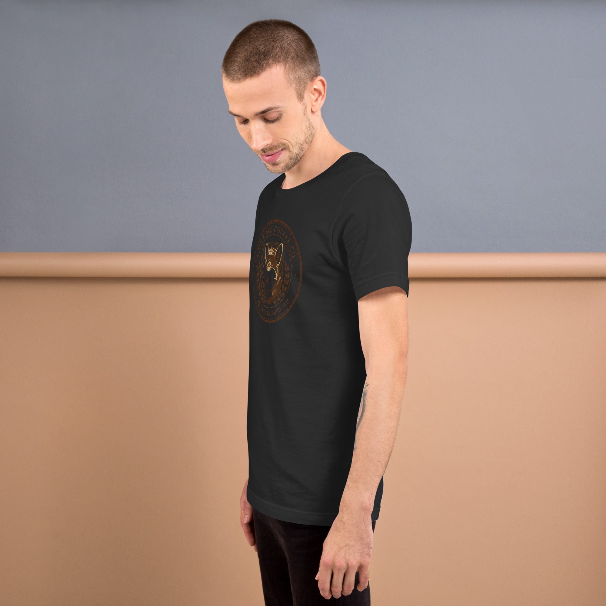 Unisex t-shirt featuring a model standing and showcasing a stylish black design.