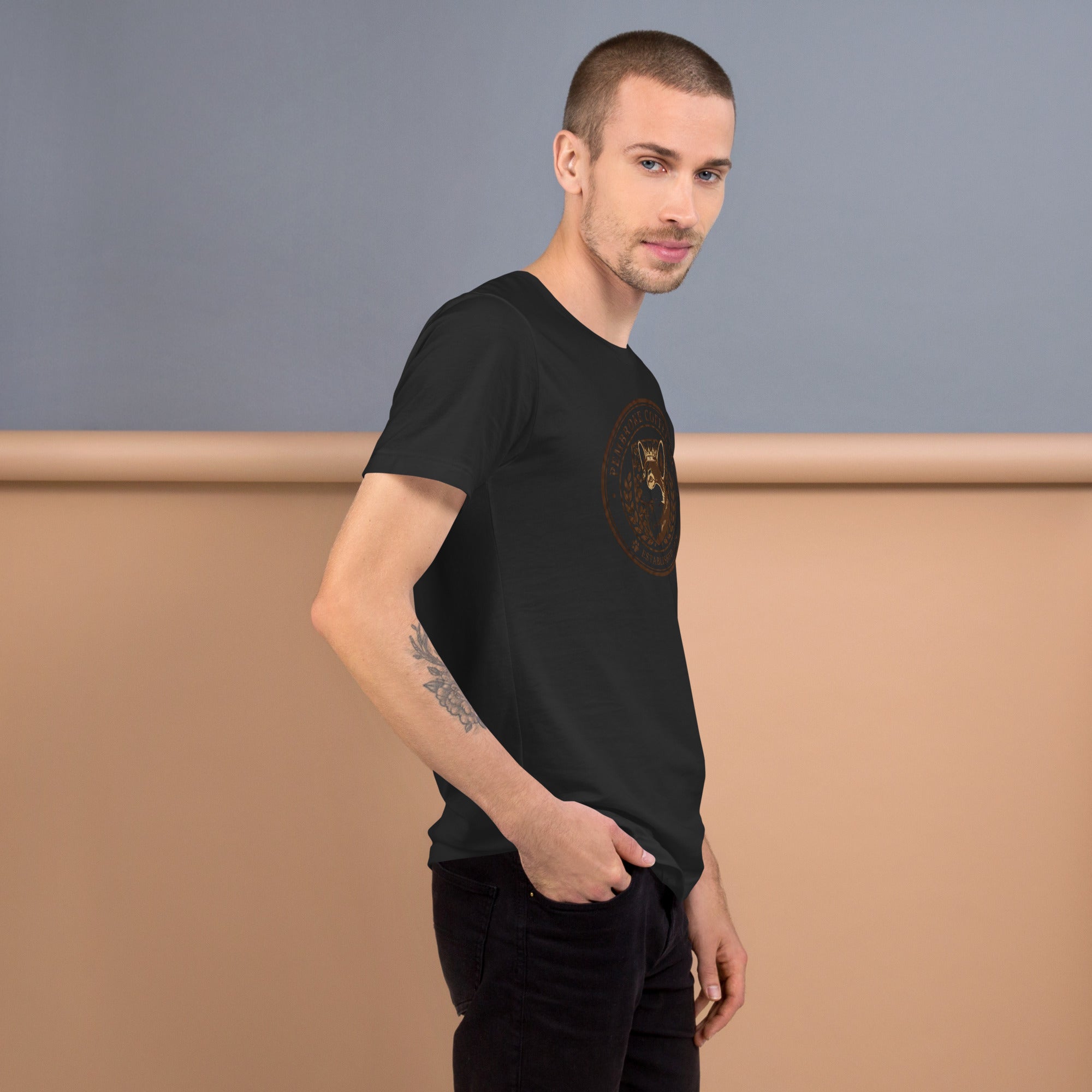 Stylish male model wearing a black unisex t-shirt featuring a unique design, showcasing comfort and fit.