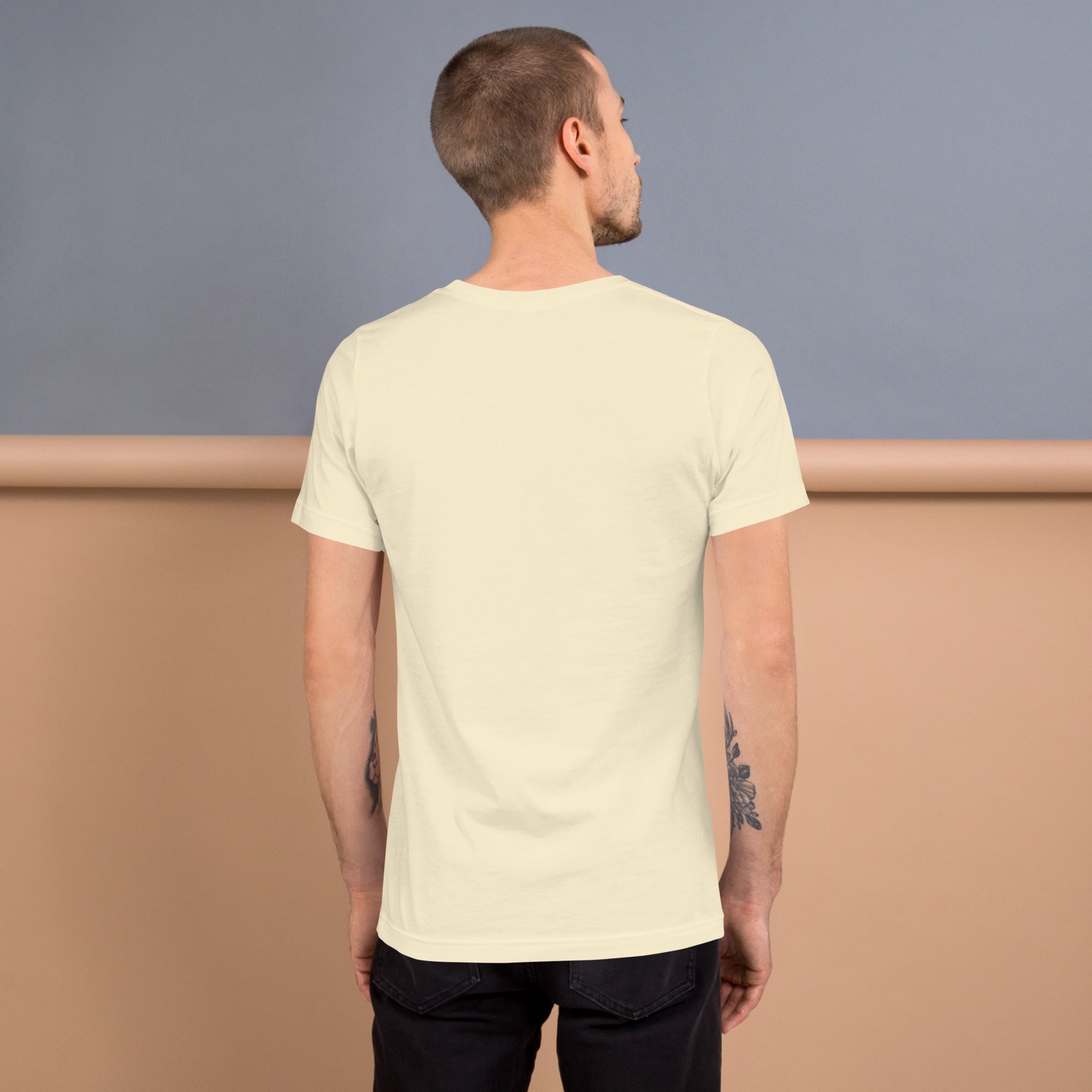 Back view of a man wearing a Unisex t-shirt, showcasing the soft and lightweight fabric for all body types.