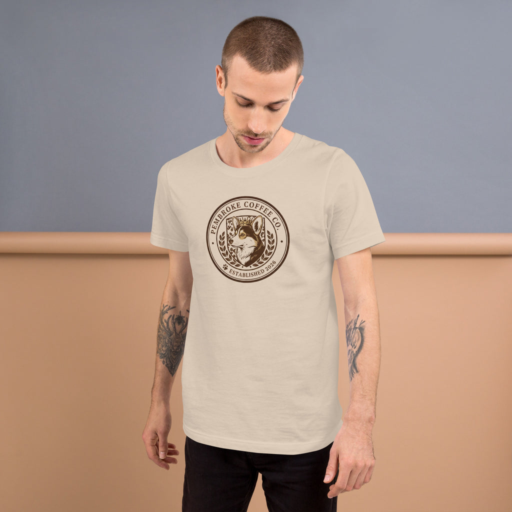 Unisex t-shirt displayed on a model, featuring a coffee company logo in a soft and lightweight material.