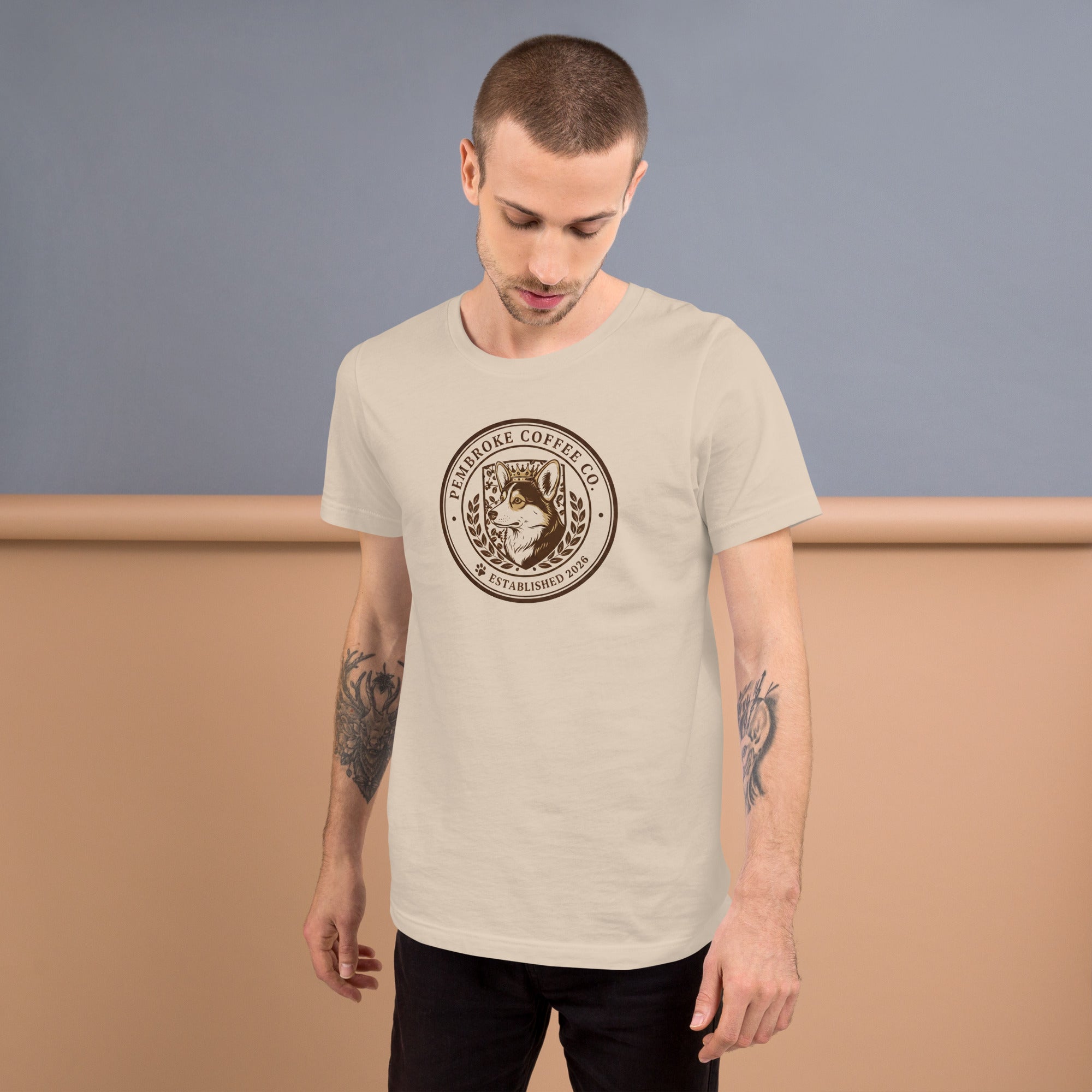 Unisex t-shirt displayed on a model, featuring a coffee company logo in a soft and lightweight material.
