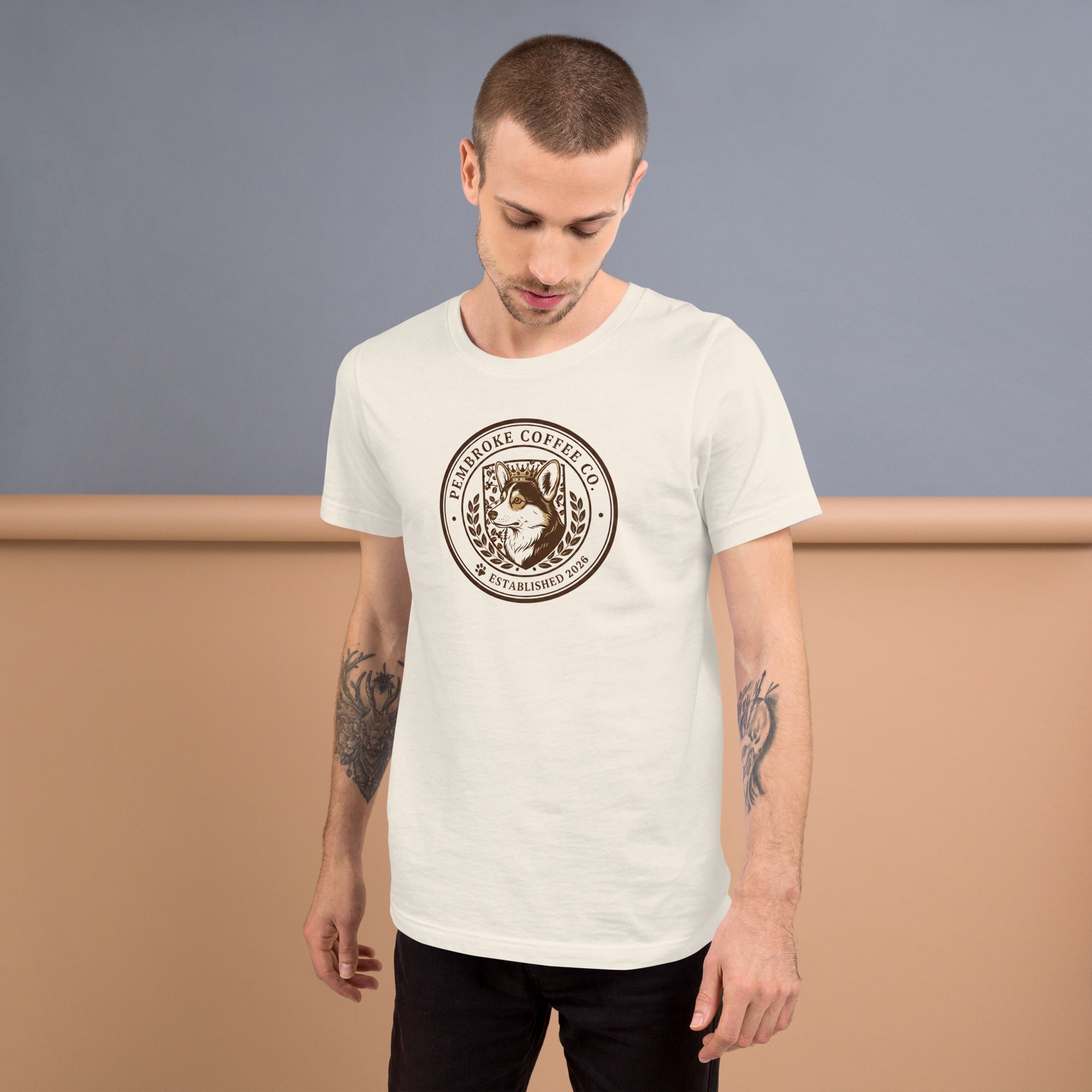 Unisex t-shirt displayed on a model, featuring a distinctive coffee logo design, perfect for casual wear.